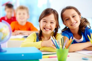 two little girls learning at St. Cecelia Interparochial Catholic School