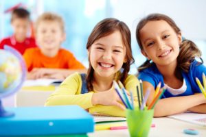 two little girls learning at St. Cecelia Interparochial Catholic School