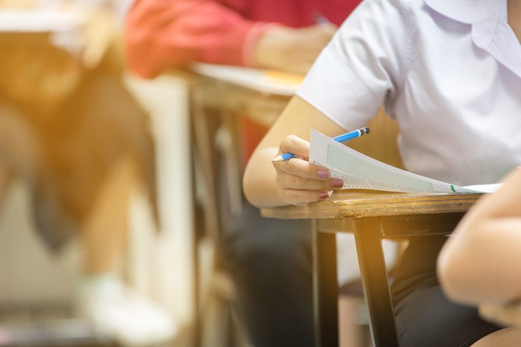 Students at desks working on test