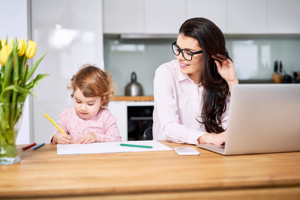 Mother helping child with their homework