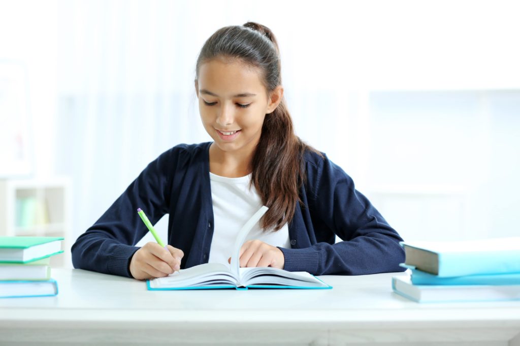 Girl working on homework at desk