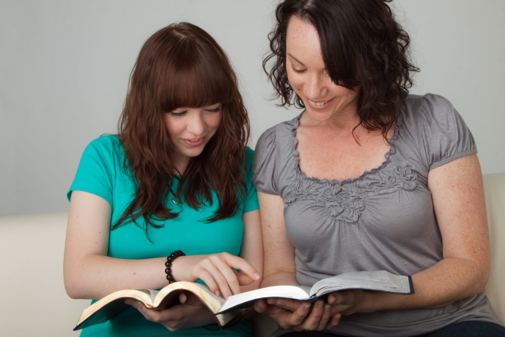 Mother and Daughter studying together