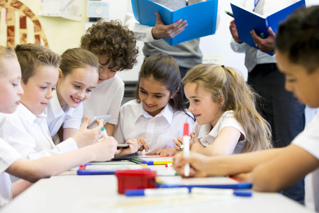 Group of children learning together in class