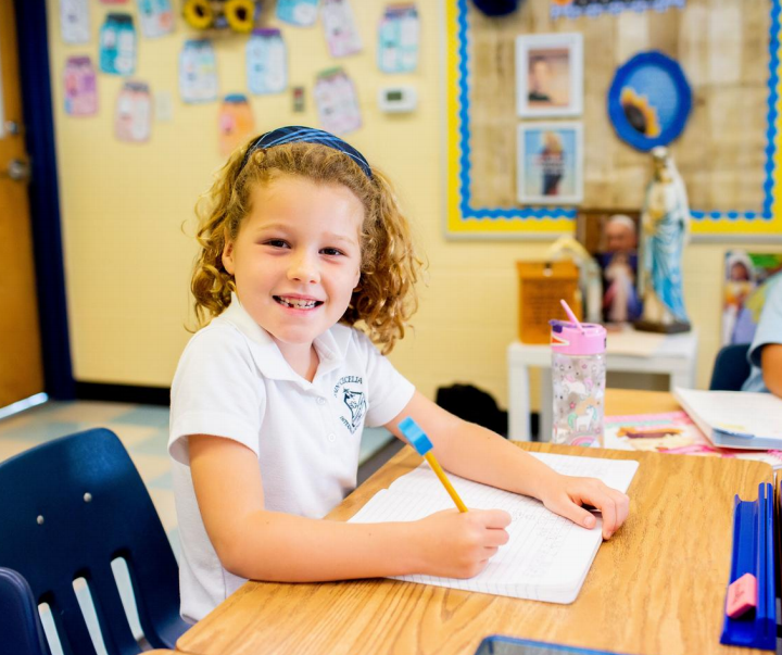 Elementary school girl sitting at desk