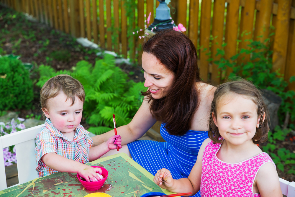 Mom and Kids Coloring Easter Eggs