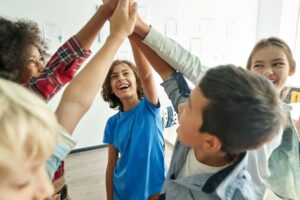 Middle school students high-fiving
